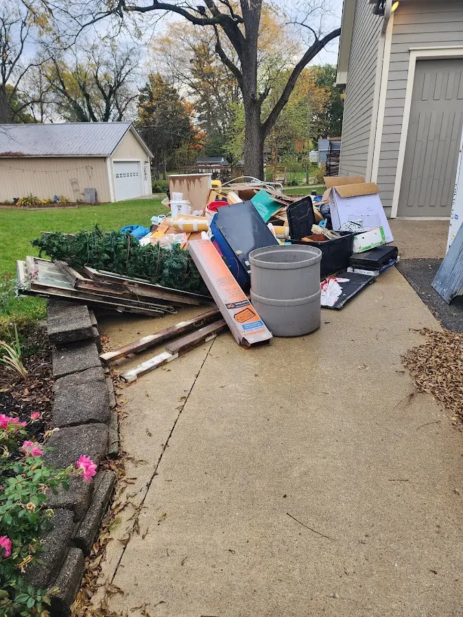 Dumpster being loaded with debris for 3 Yard Dumpster Rental in Clay Center